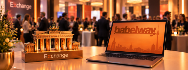 Laptop displaying the Babelway logo and Berlin skyline beside a Brandenburg Gate model at the E-Invoicing Exchange Summit Europe, representing Germany's e-invoicing mandate for SMBs